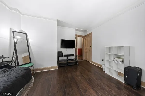 a view of a livingroom with furniture and a flat screen tv