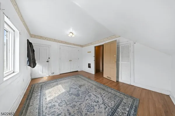 a view of a livingroom with an empty space and a window