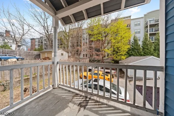 a view of a balcony with chairs