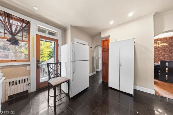 a view of hallway with furniture and a window