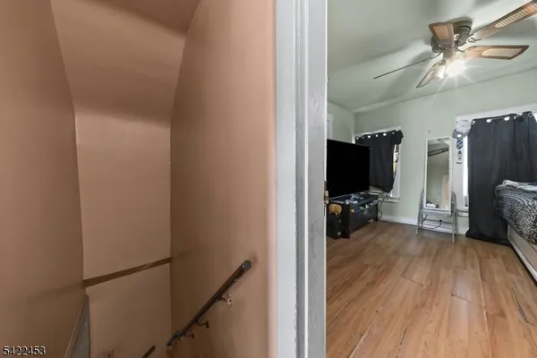 a view of a workspace with furniture and wooden floor