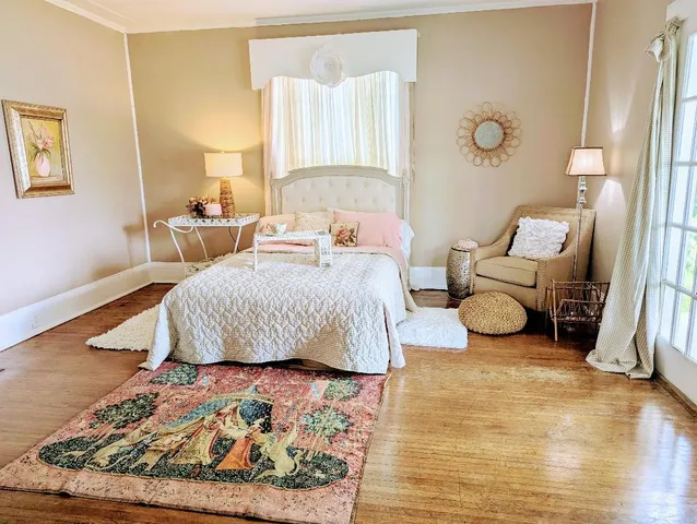 a bedroom with bed and a window