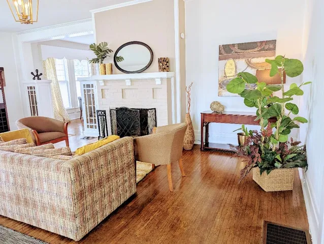 a living room with furniture and a fireplace