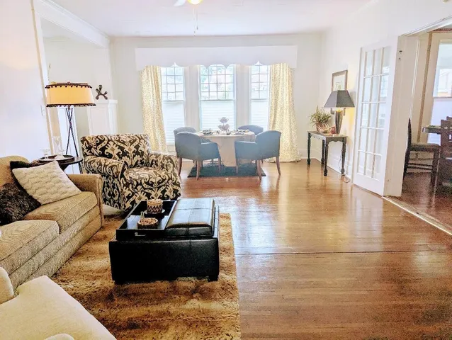a living room with furniture window and a table