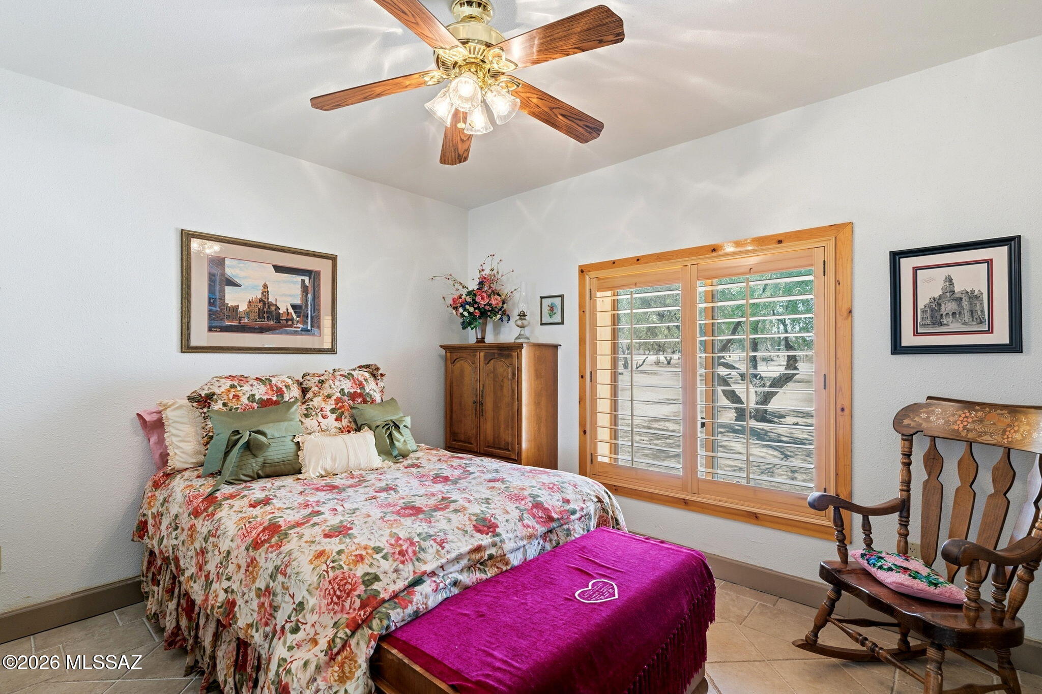 12810 West Gunsmoke Road Tucson, AZ 85736 - Photo 26 of 51 a bedroom with a bed a couch and a large window