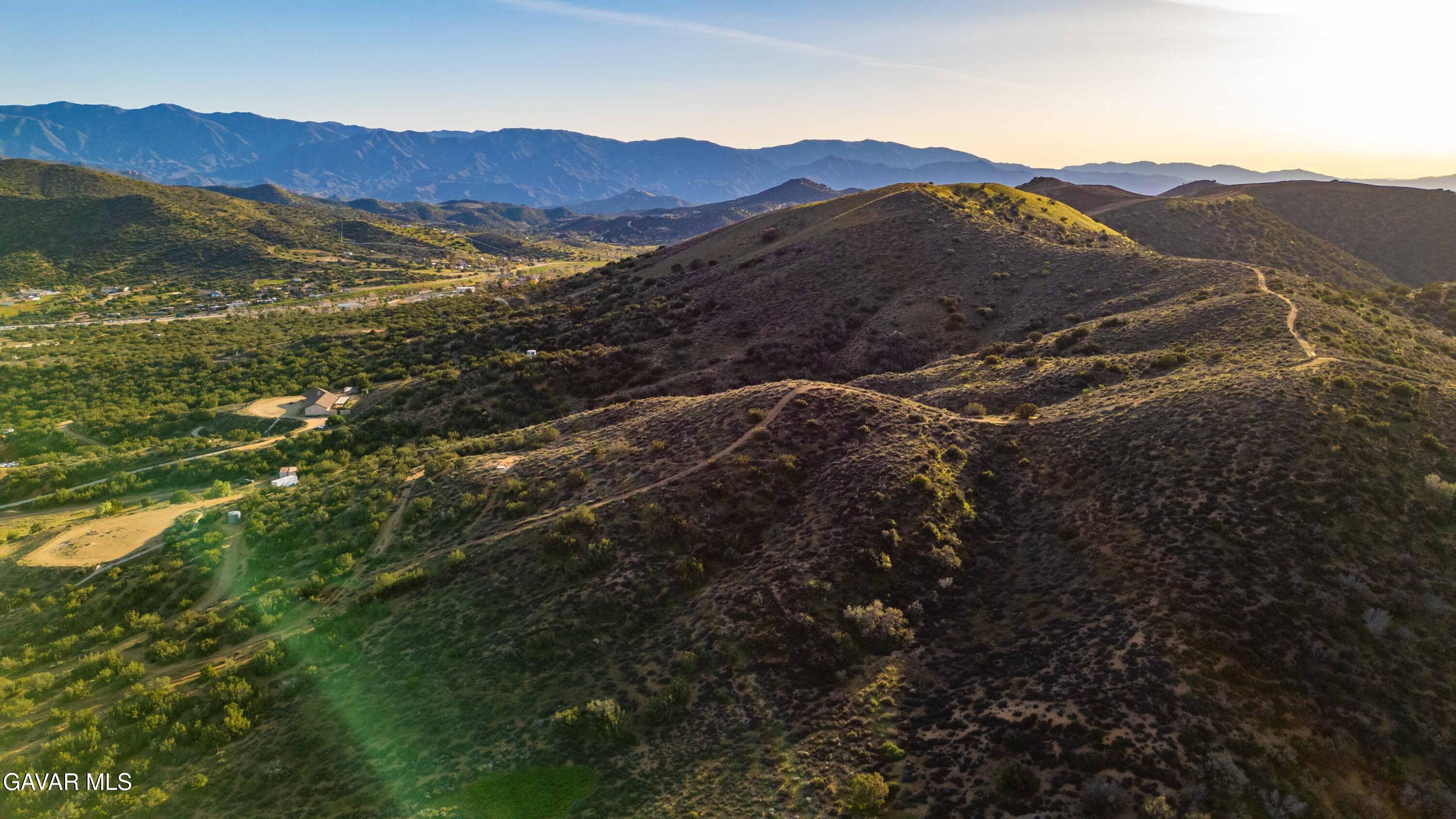 Vic Quail Road Santa Clarita, CA 91390 - Photo 8 of 12 a view of a mountain range with lush green hillside