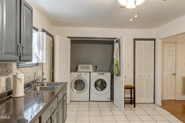 a kitchen with stainless steel appliances a stove refrigerator sink and cabinets
