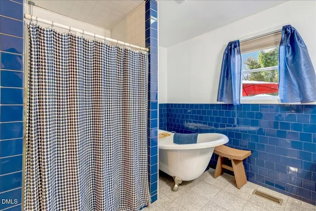 a bedroom with bed and window