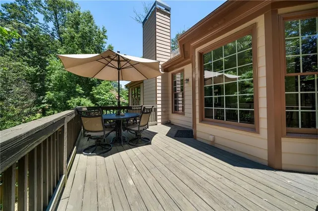 a view of a two chairs and table in the balcony
