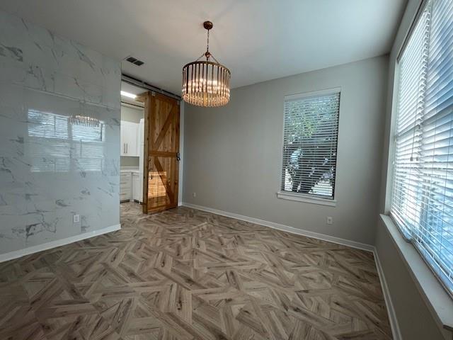 622 Hemphill Street, Unit 202 Fort Worth, TX 76104 - Photo 10 of 15 a view of empty room with wooden floor and window