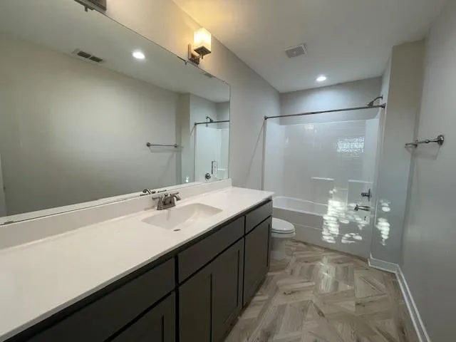 a bathroom with a sink and mirror