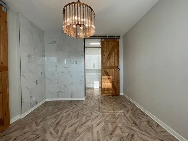 en empty room with wooden floor