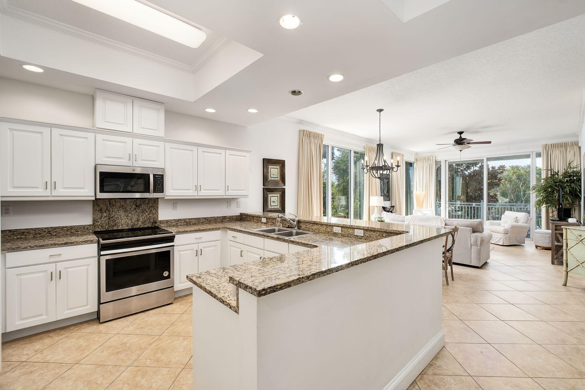 9961 East County Highway 30A, Unit 202 Inlet Beach, FL 32461 - Photo 11 of 44 a kitchen with stainless steel appliances granite countertop a stove and a sink