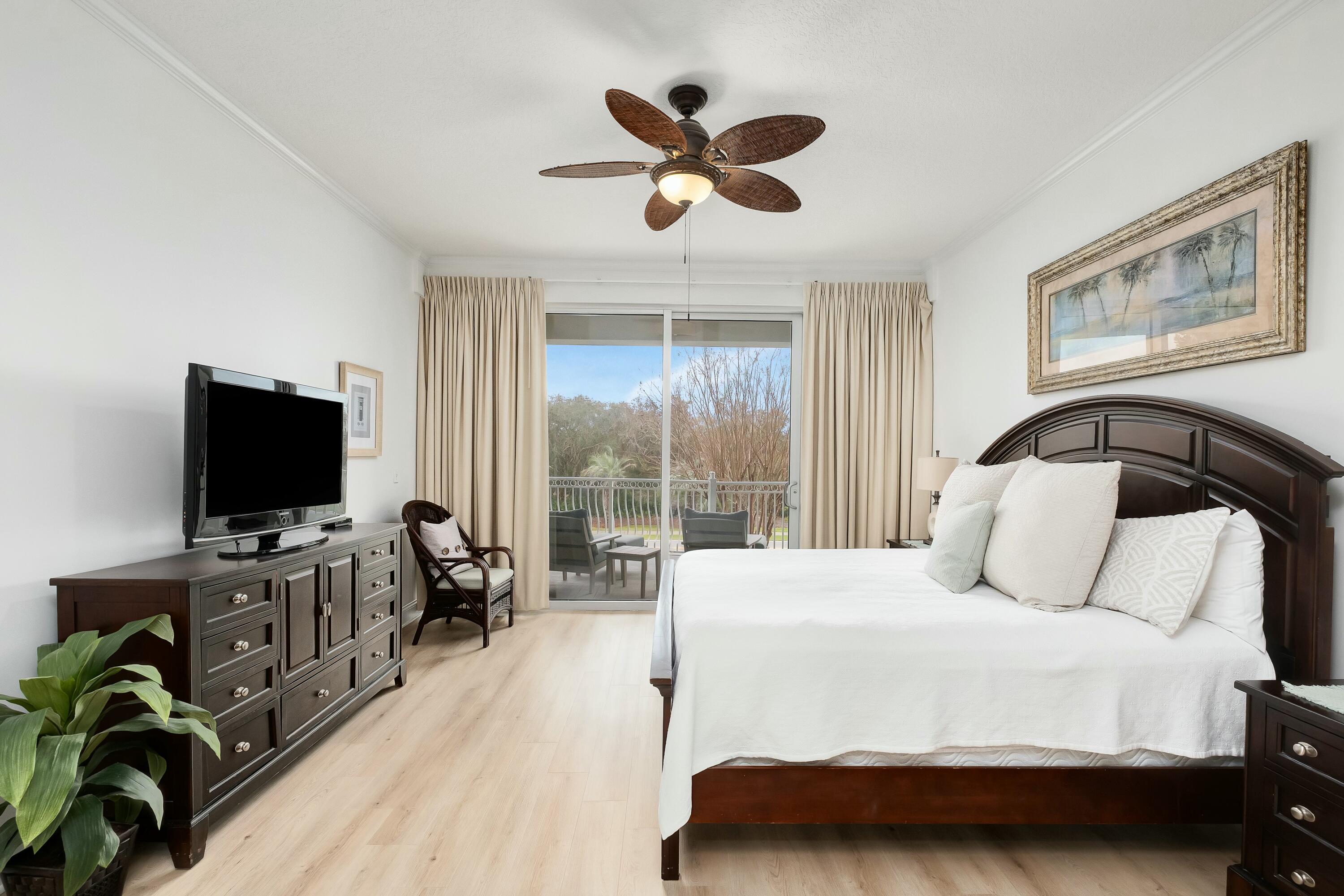 9961 East County Highway 30A, Unit 202 Inlet Beach, FL 32461 - Photo 14 of 44 a bedroom with a bed and a flat screen tv with the outer view