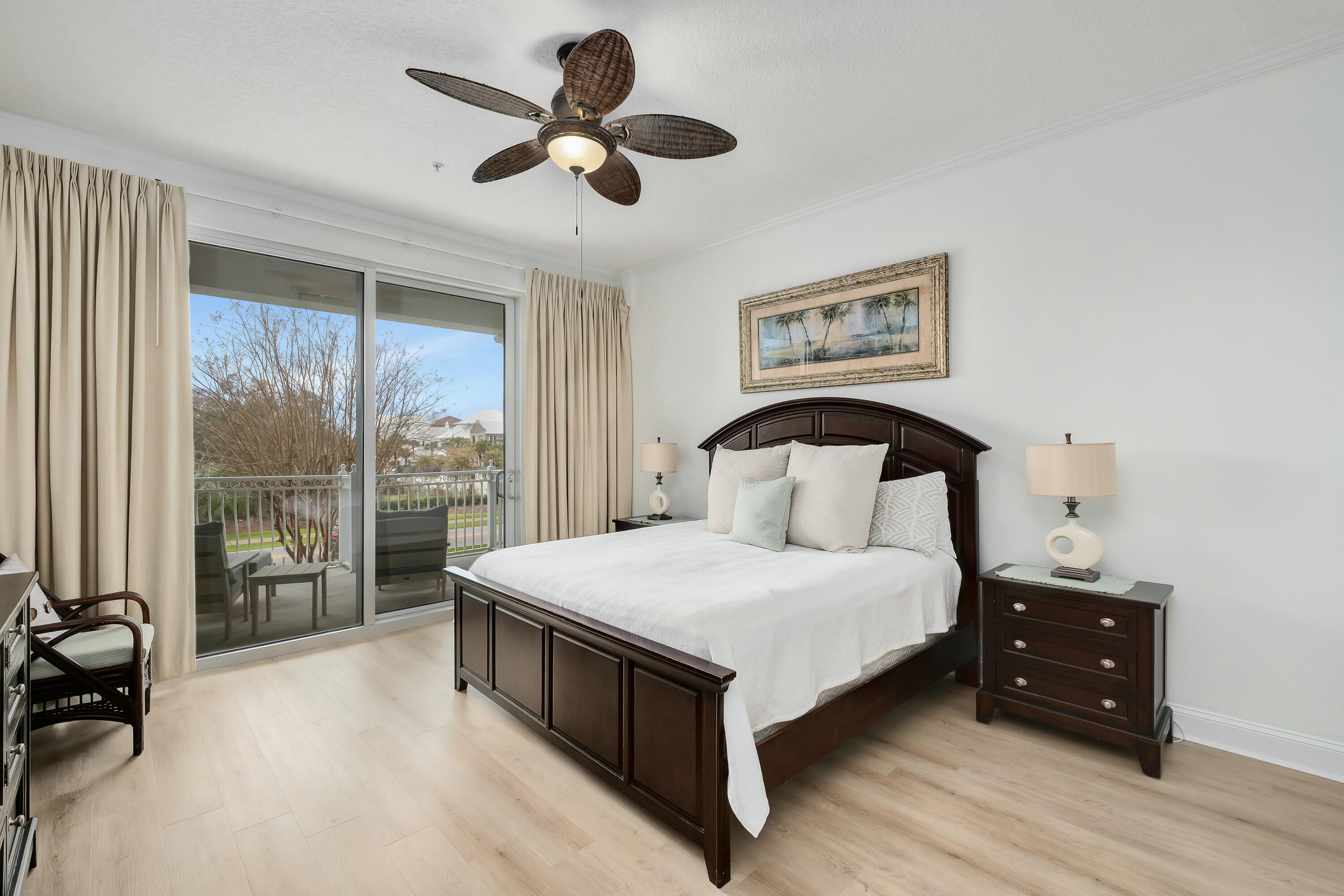 9961 East County Highway 30A, Unit 202 Inlet Beach, FL 32461 - Photo 15 of 44 a bedroom with a large bed and a large window