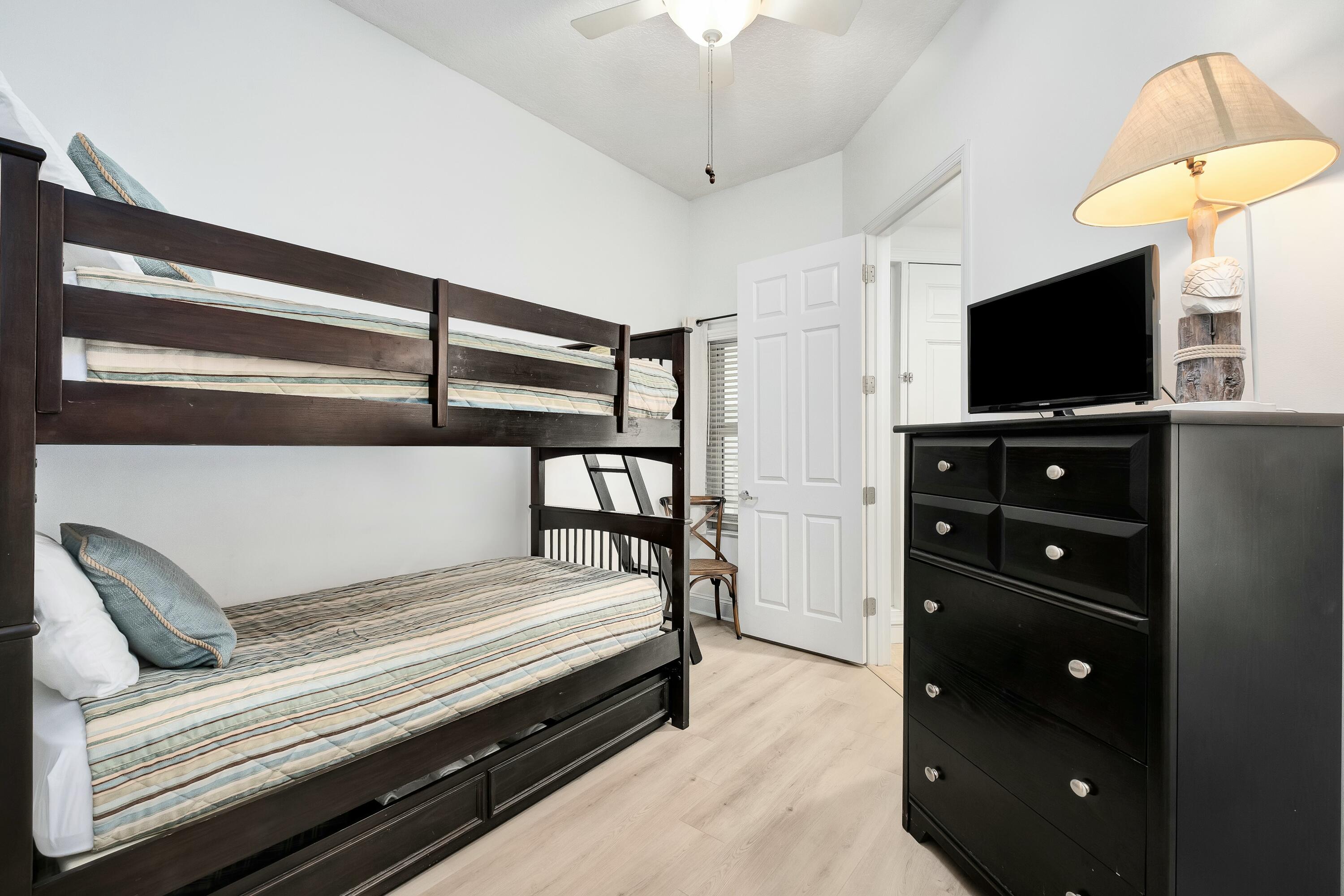 9961 East County Highway 30A, Unit 202 Inlet Beach, FL 32461 - Photo 23 of 44 a bedroom with a bed and a flat screen tv