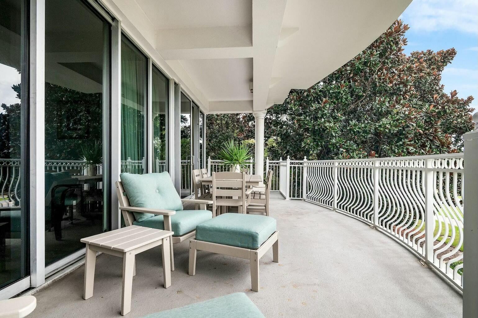 9961 East County Highway 30A, Unit 202 Inlet Beach, FL 32461 - Photo 6 of 44 a view of a patio with a dining table and chairs with wooden floor