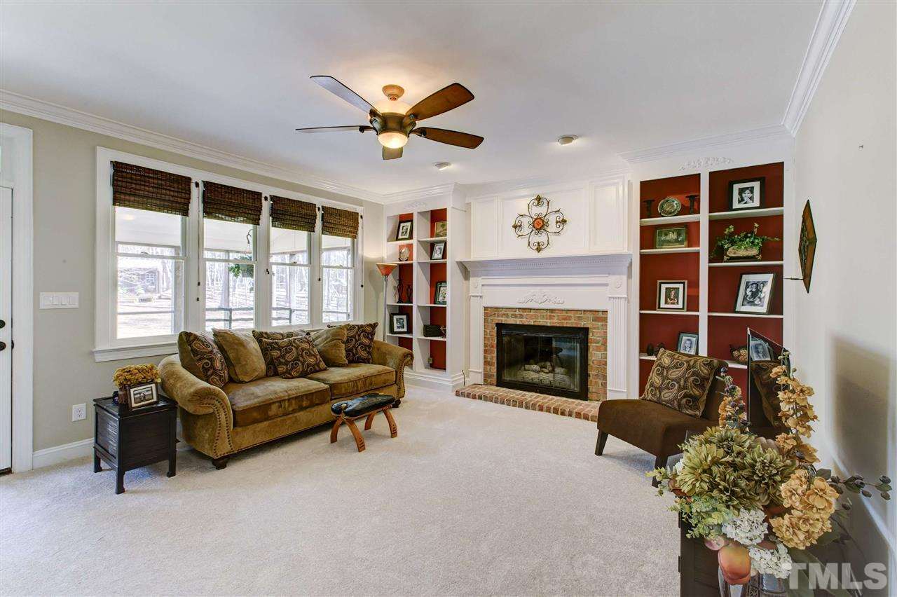 6300 Battleview Drive Raleigh, NC 27613 - Photo 11 of 25 a living room with furniture and a fireplace