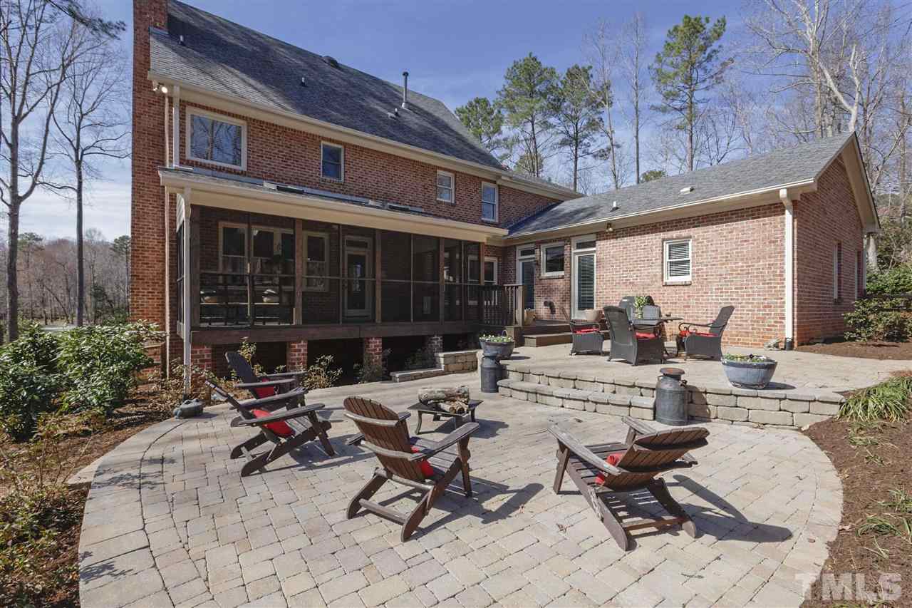 6300 Battleview Drive Raleigh, NC 27613 - Photo 14 of 25 a view of a patio with a table and chairs and potted plants