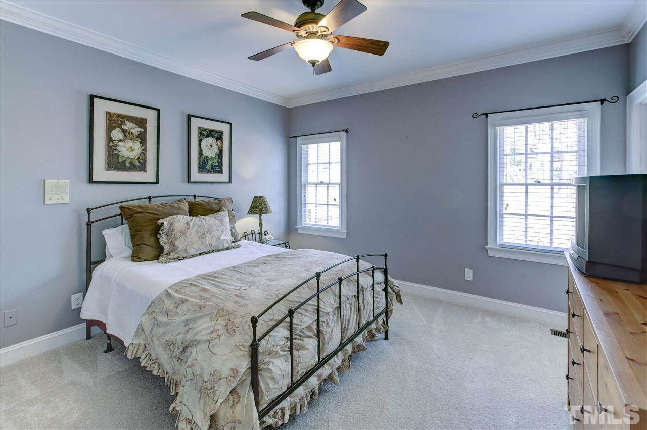 6300 Battleview Drive Raleigh, NC 27613 - Photo 16 of 25 a bedroom with bed tv and window