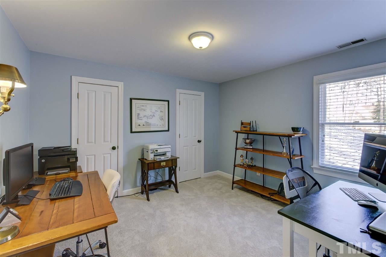 6300 Battleview Drive Raleigh, NC 27613 - Photo 22 of 25 a room with furniture and a window
