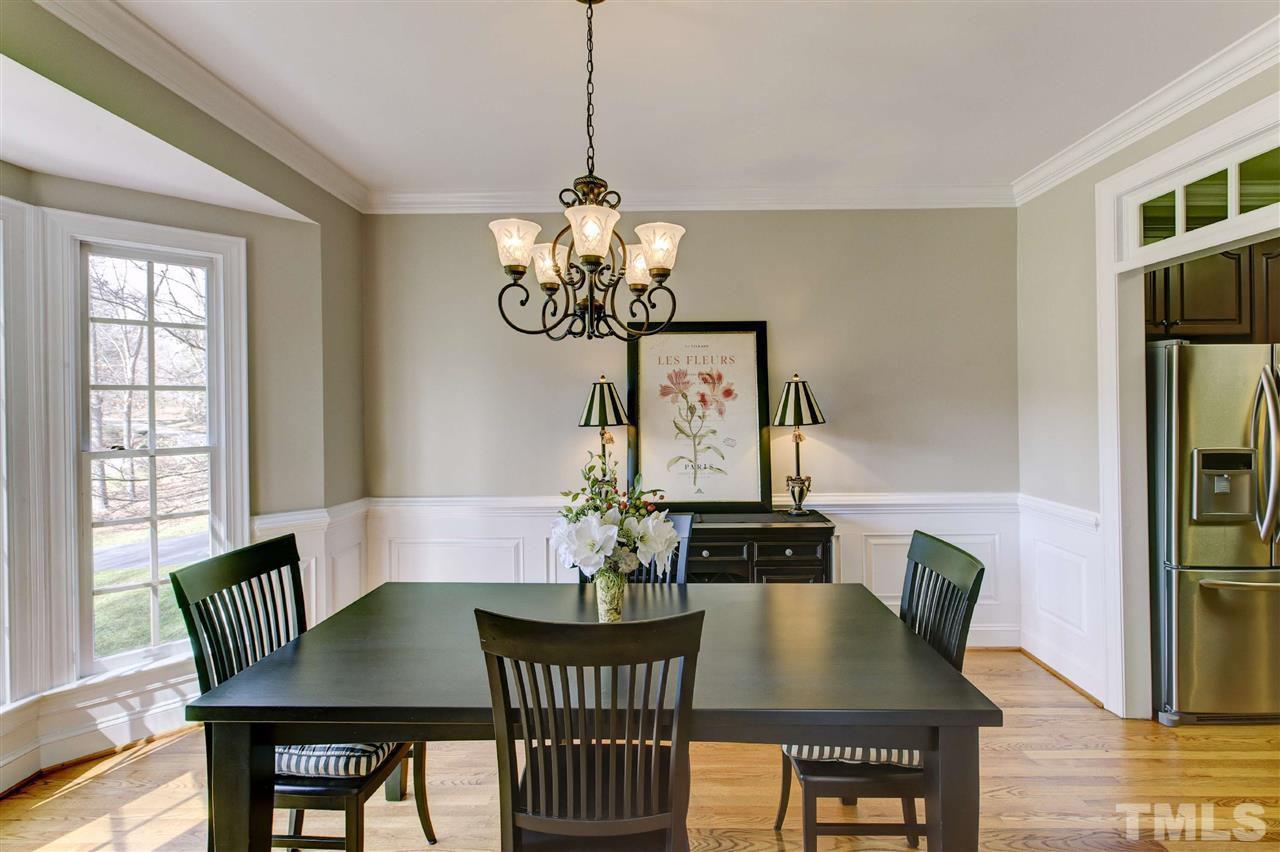 6300 Battleview Drive Raleigh, NC 27613 - Photo 5 of 25 a view of a dining room with furniture and wooden floor