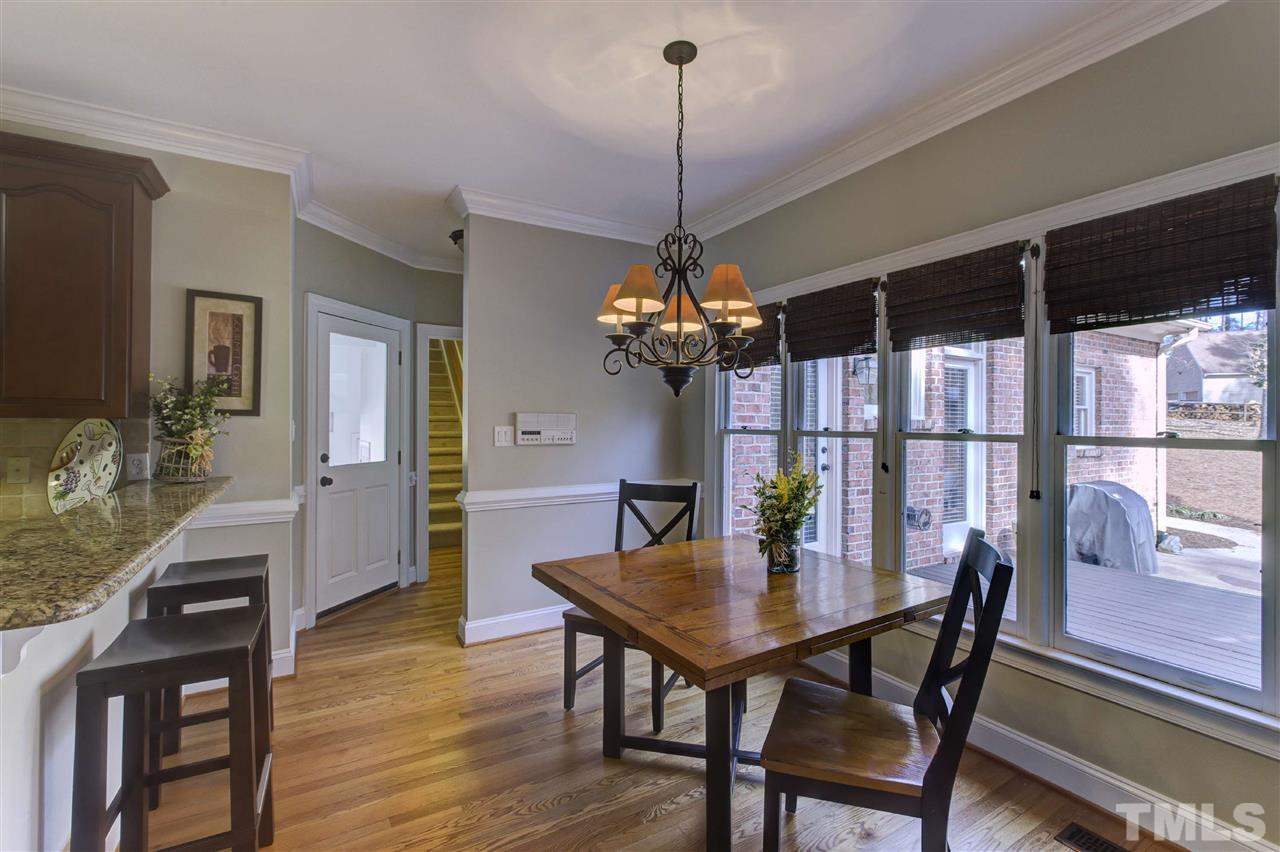 6300 Battleview Drive Raleigh, NC 27613 - Photo 9 of 25 a view of a dining room with furniture window and wooden floor