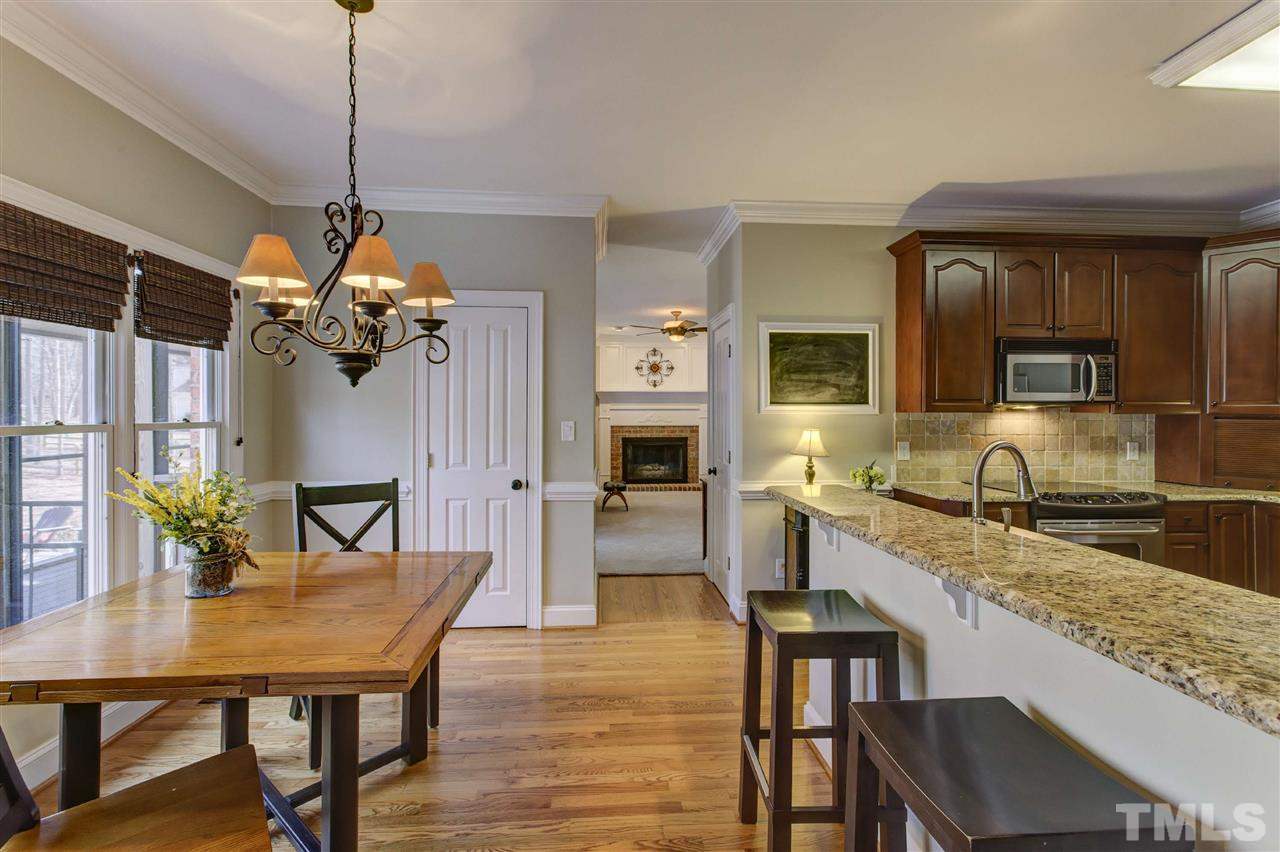 6300 Battleview Drive Raleigh, NC 27613 - Photo 10 of 25 a view of a dining room with furniture window and wooden floor