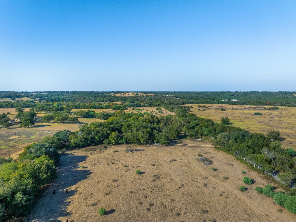 217 Robin Ranch Road Lockhart, TX 78644 - Photo 14 of 15 a view of a lake with houses in the back