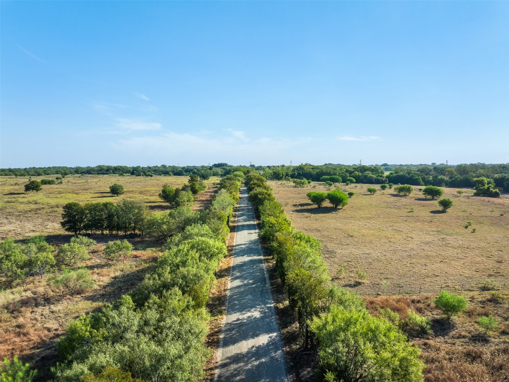 217 Robin Ranch Road Lockhart, TX 78644 - Photo 15 of 15 a view of a lake with houses in the back