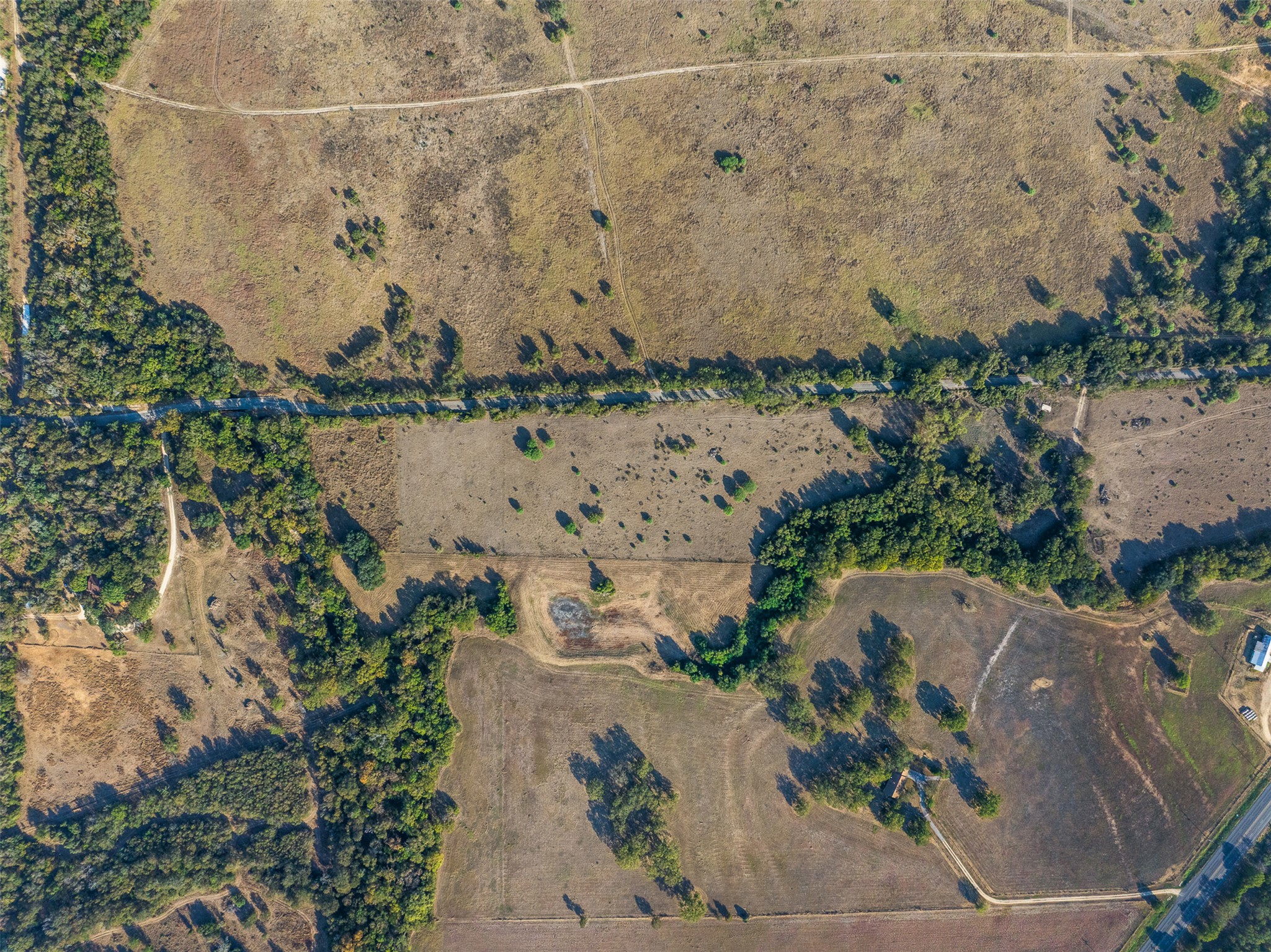 217 Robin Ranch Road Lockhart, TX 78644 - Photo 7 of 15 Aerial view of property and surrounding area with rural landscape