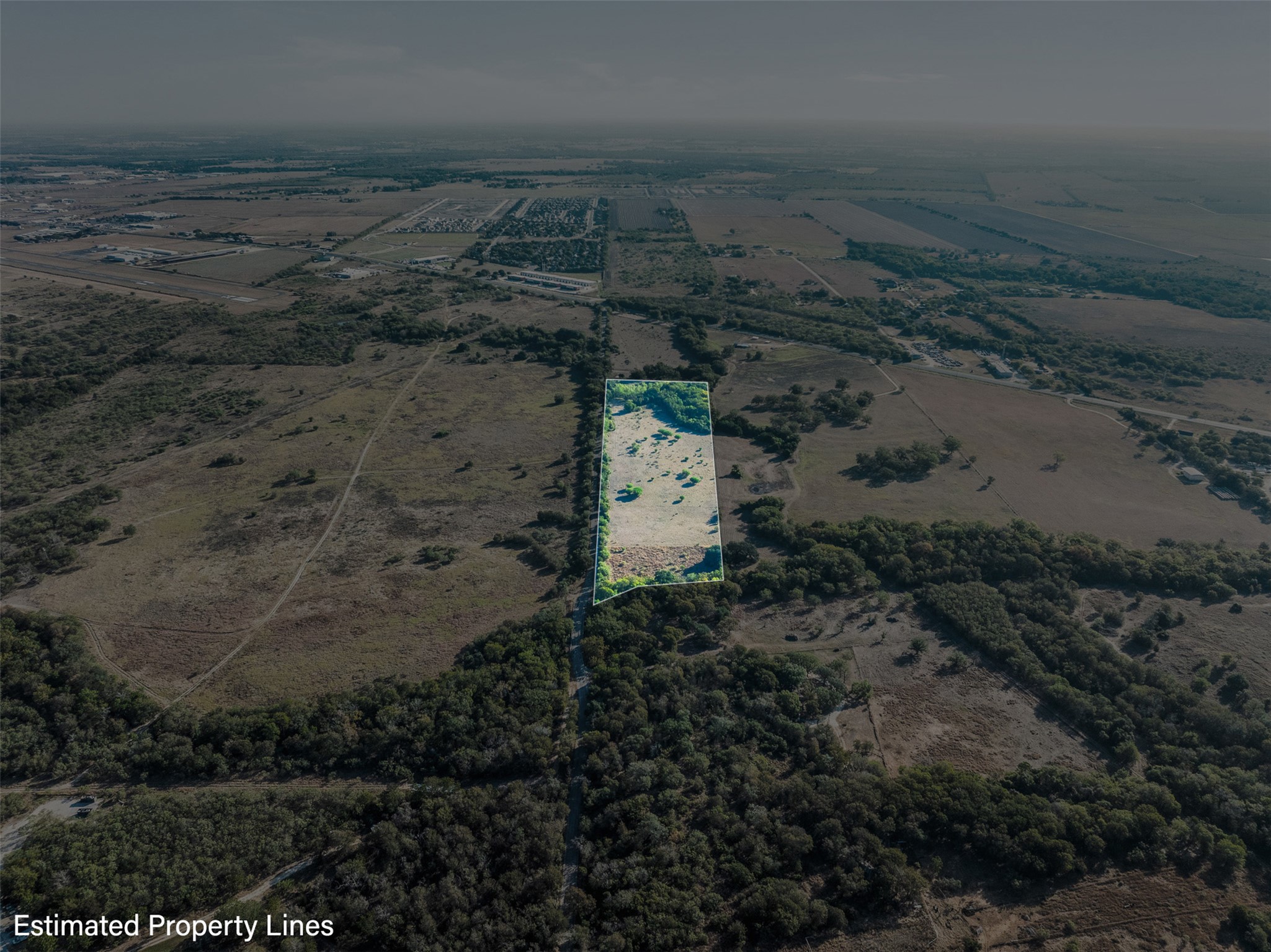 217 Robin Ranch Road Lockhart, TX 78644 - Photo 8 of 15 Overview of rural landscape featuring property boundaries highlighted