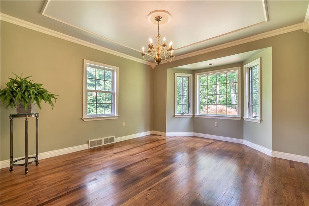121 Sylvania Drive Pittsburgh, PA 15236 - Photo 7 of 25 DINING ROOM WITH HARDWOOD FLOORING, CROWN MOLDING, BAY WINDOW AND TRAY CEILING. THIS ROOM ALSO HAS A BUILT IN CABINET.