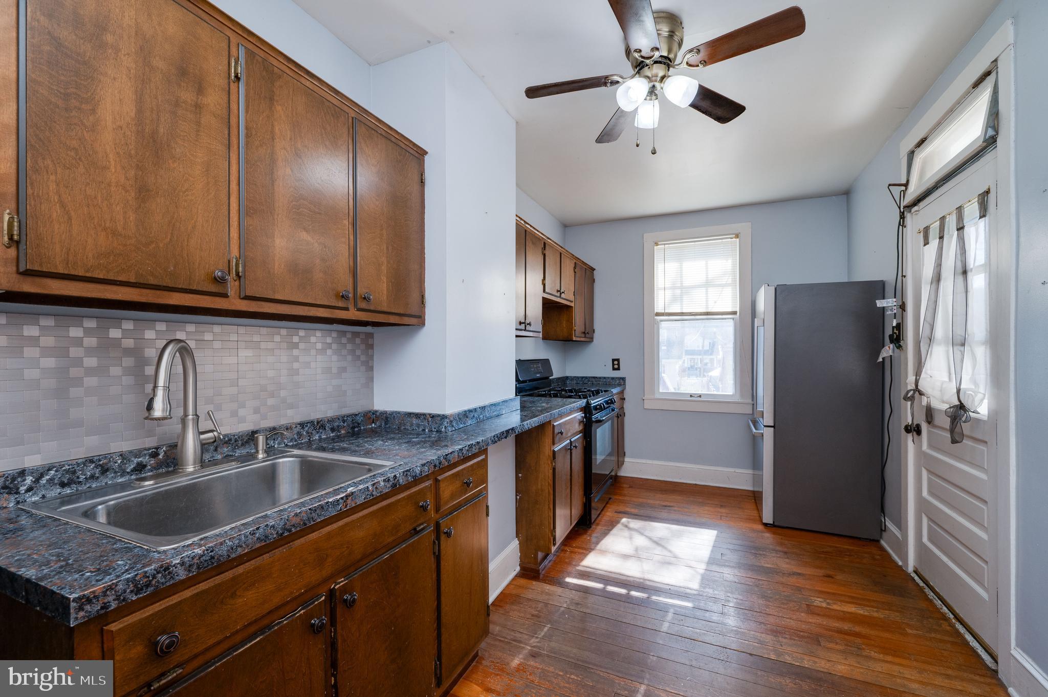 7 Marshall Avenue Reading, PA 19606 - Photo 14 of 36 a kitchen that has a sink stainless steel appliances a counter space and cabinets