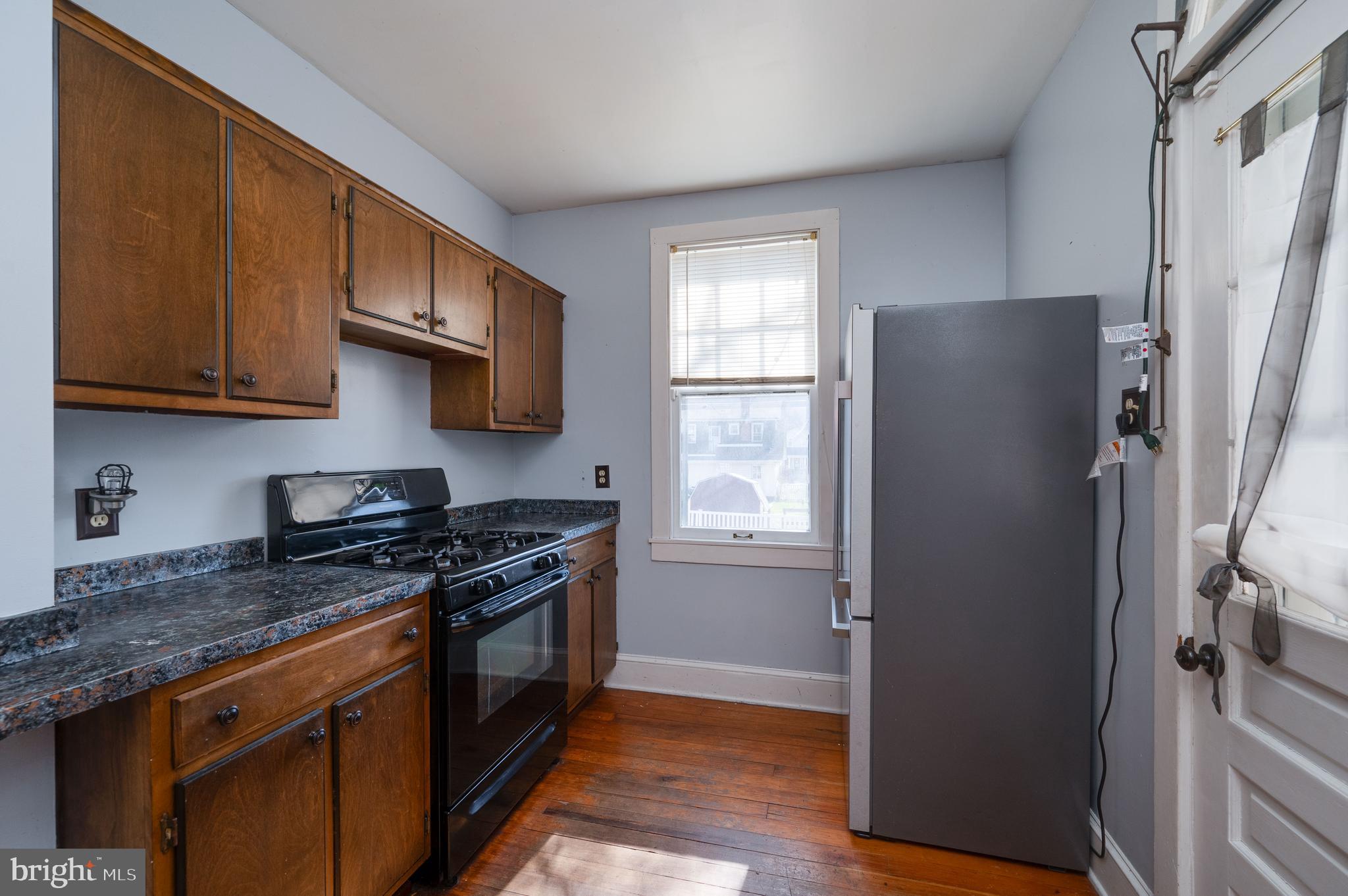 7 Marshall Avenue Reading, PA 19606 - Photo 15 of 36 a kitchen with stainless steel appliances granite countertop a stove a refrigerator and a sink