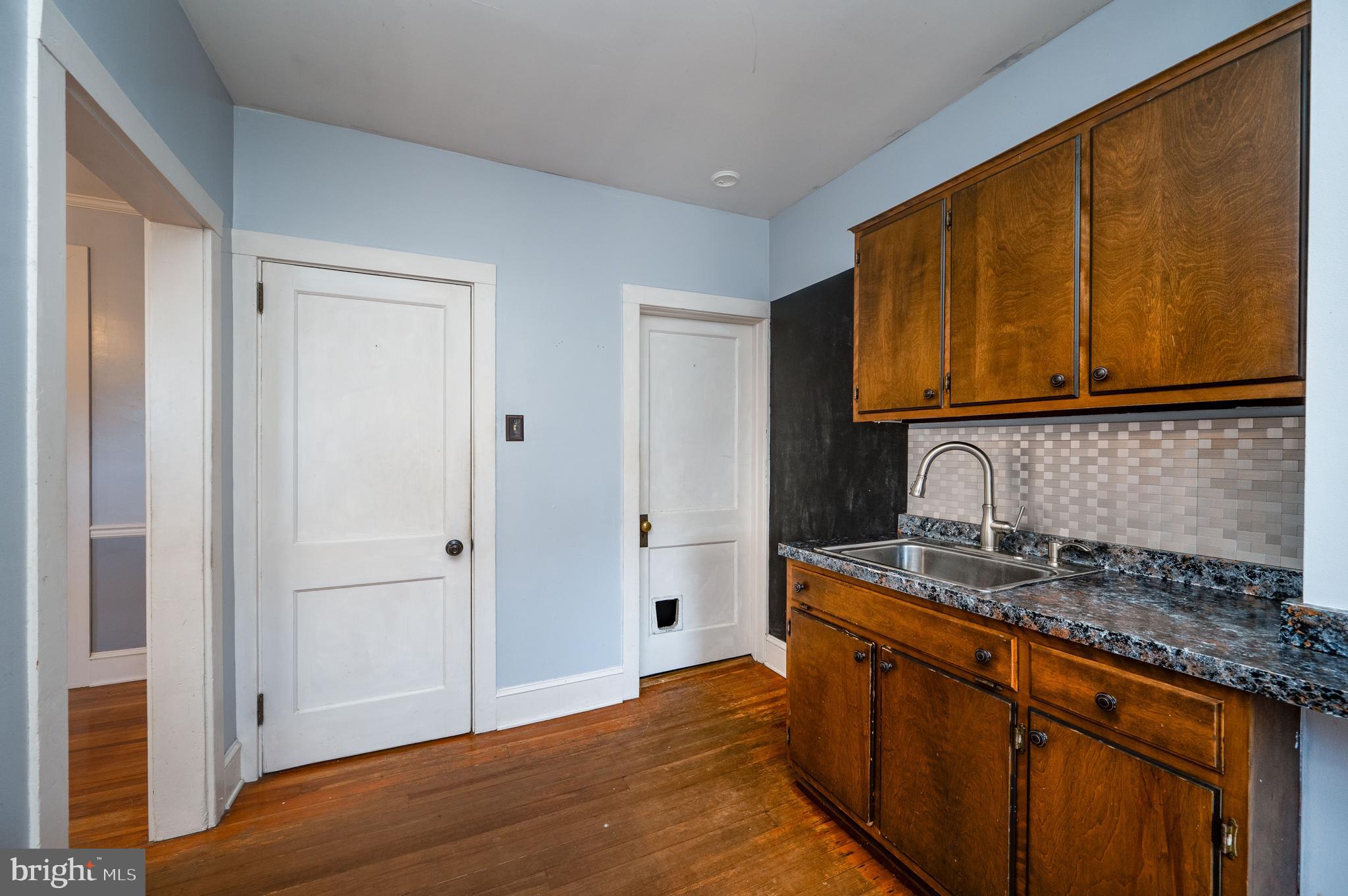 7 Marshall Avenue Reading, PA 19606 - Photo 17 of 36 a kitchen with stainless steel appliances granite countertop cabinets and wooden floor