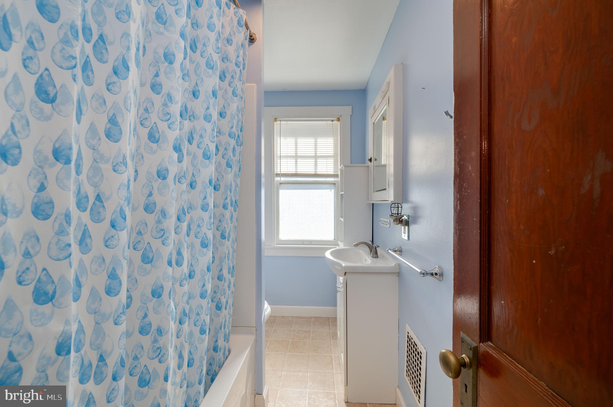 7 Marshall Avenue Reading, PA 19606 - Photo 18 of 36 a bathroom with a granite countertop sink a mirror and a shower