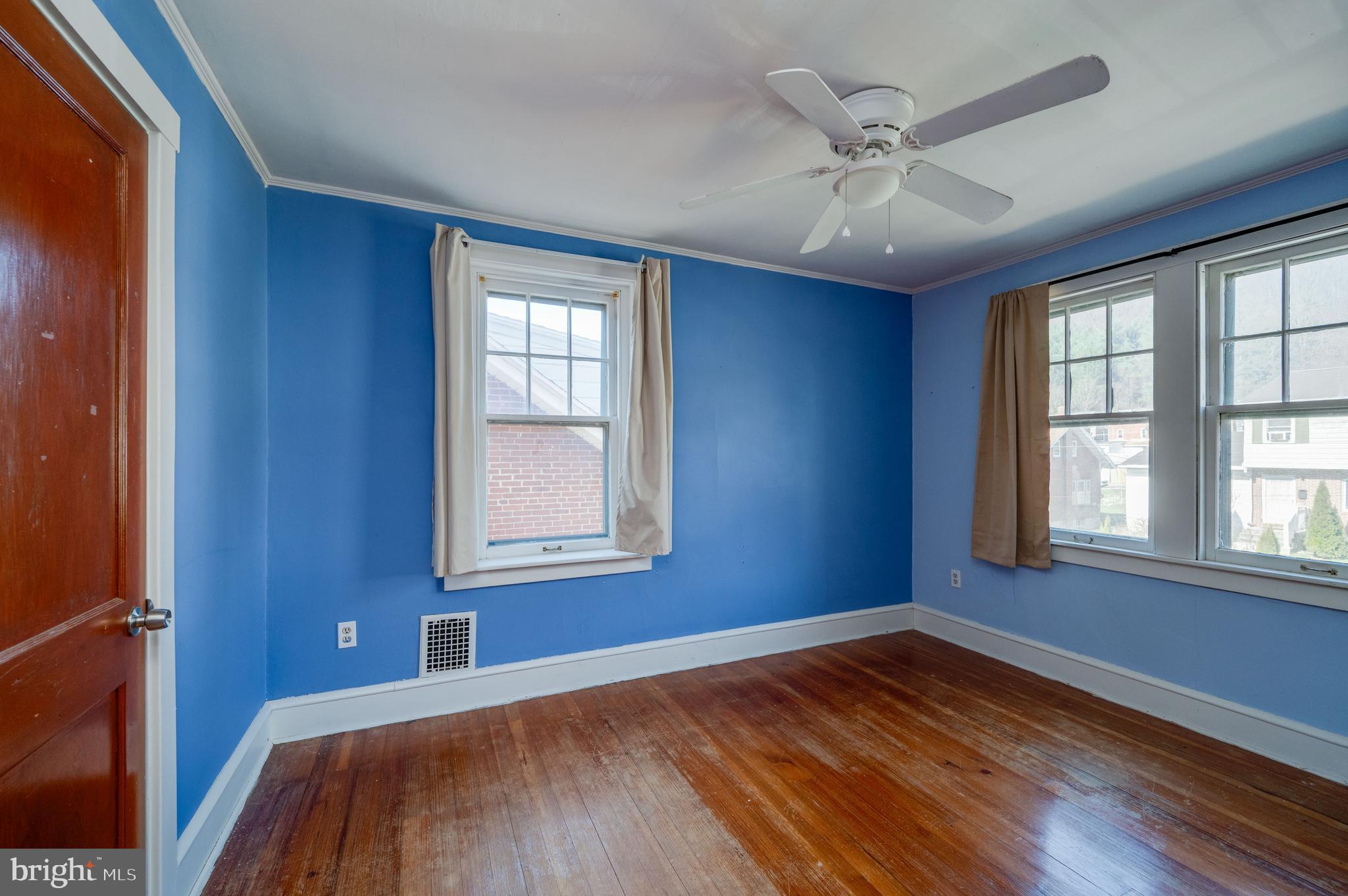 7 Marshall Avenue Reading, PA 19606 - Photo 23 of 36 an empty room with wooden floor fan and windows