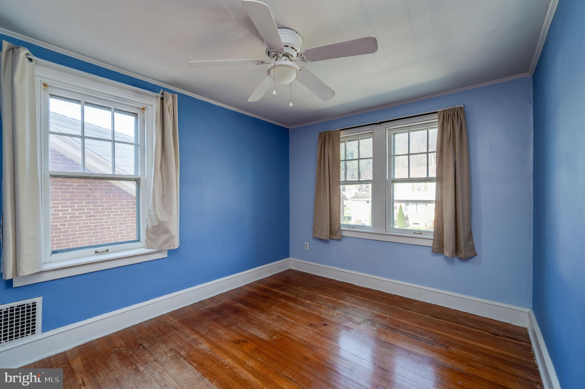 7 Marshall Avenue Reading, PA 19606 - Photo 24 of 36 an empty room with wooden floor and windows