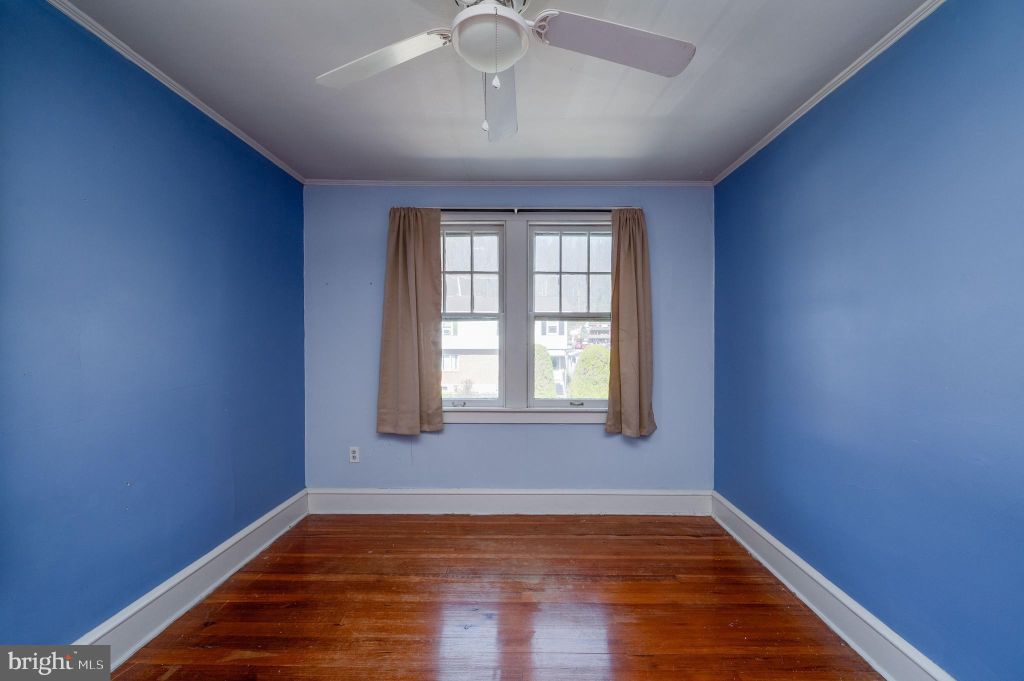 7 Marshall Avenue Reading, PA 19606 - Photo 25 of 36 a view of an empty room with wooden floor and a window