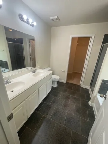 a room with a washing machine and sink