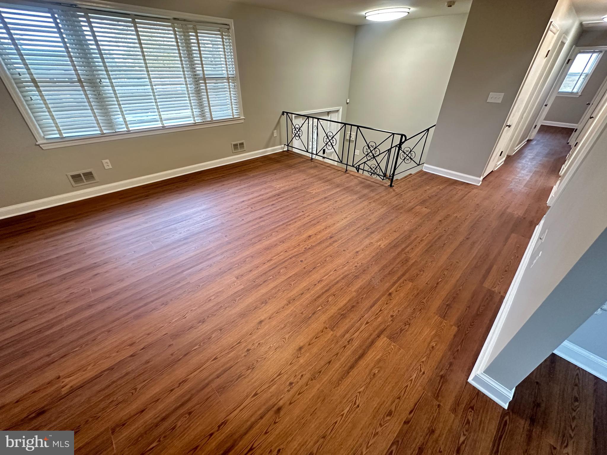 3912 21st Avenue Temple Hills, MD 20748 - Photo 15 of 36 a view of an empty room with wooden floor and a window