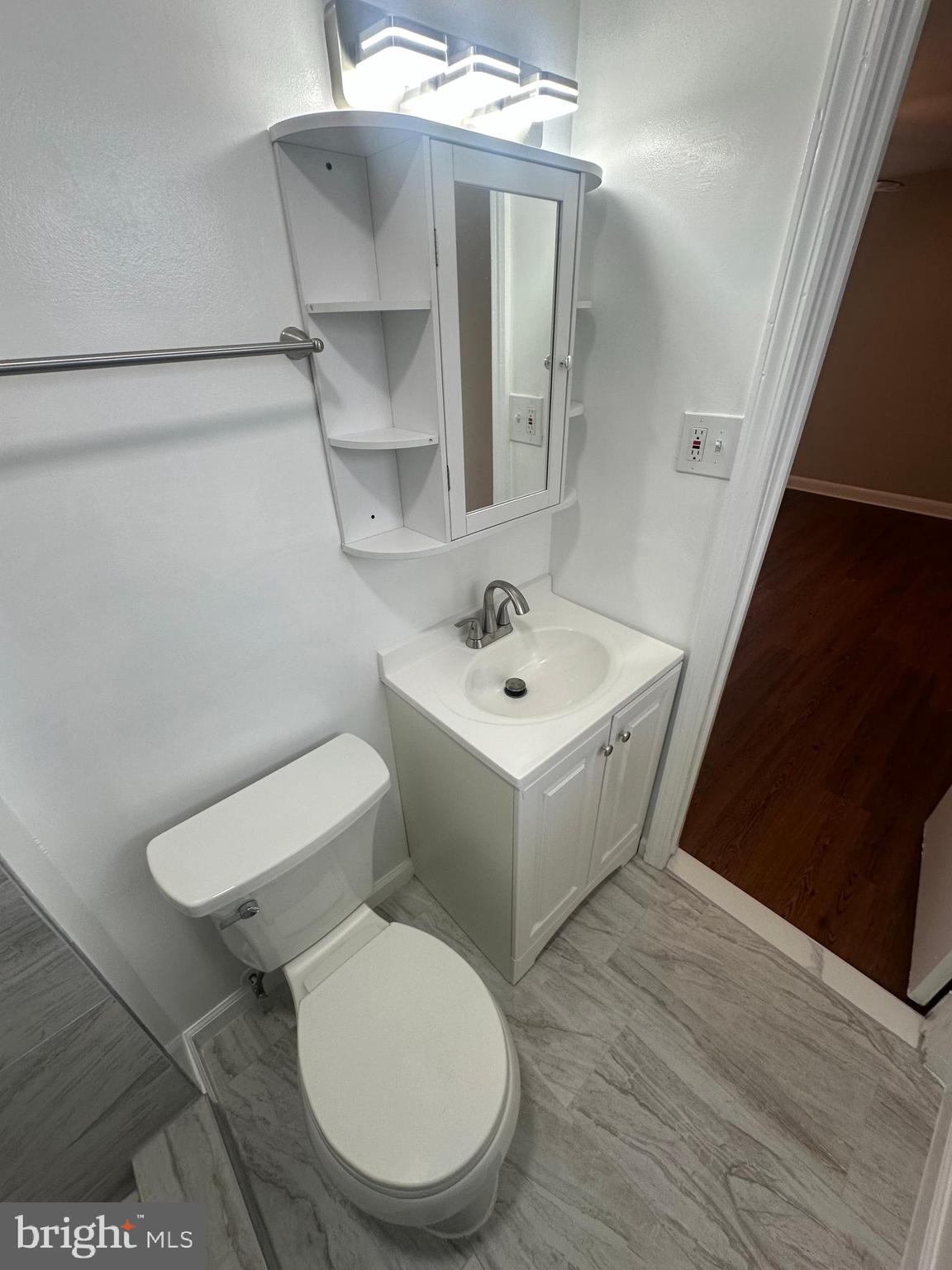 3912 21st Avenue Temple Hills, MD 20748 - Photo 24 of 36 a white toilet sitting next to a bathroom sink