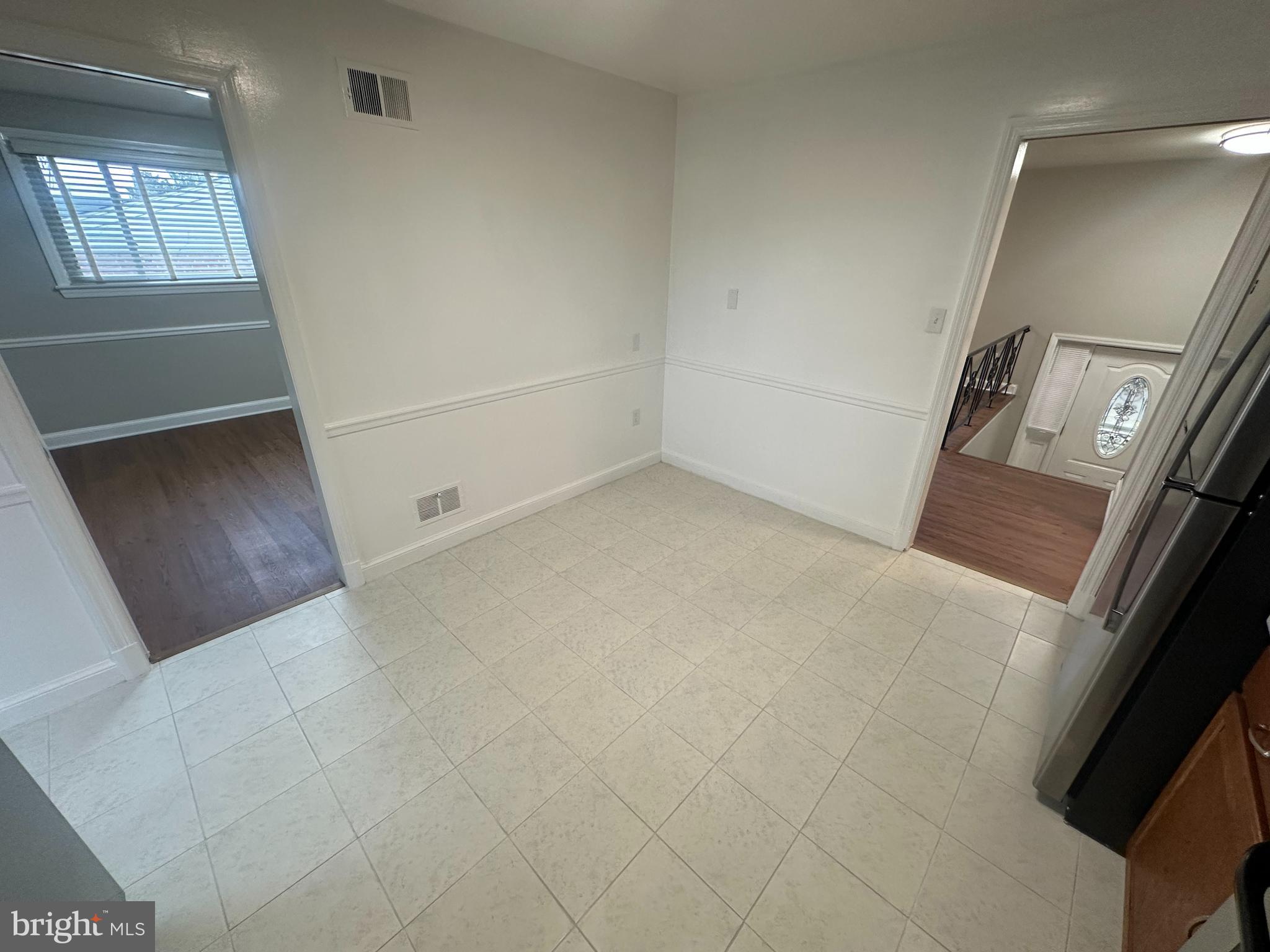 3912 21st Avenue Temple Hills, MD 20748 - Photo 4 of 36 an empty room with windows