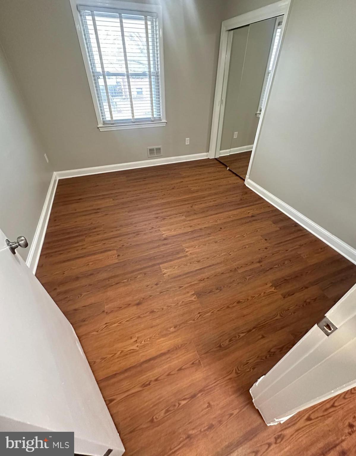 3912 21st Avenue Temple Hills, MD 20748 - Photo 9 of 36 a view of a room with wooden floor and staircase