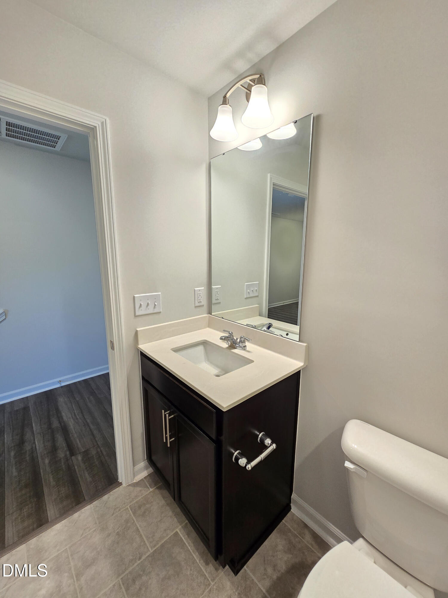 2431 Kasota Lane Raleigh, NC 27610 - Photo 10 of 46 a bathroom with a sink and a mirror