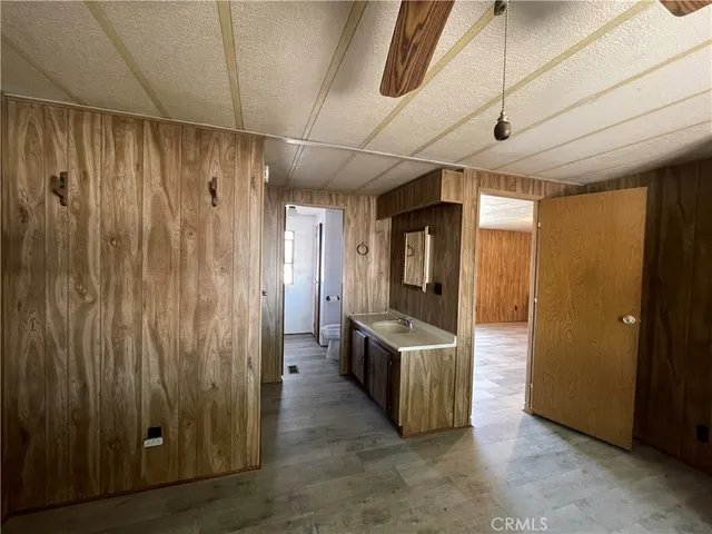a view of a room with table and chairs