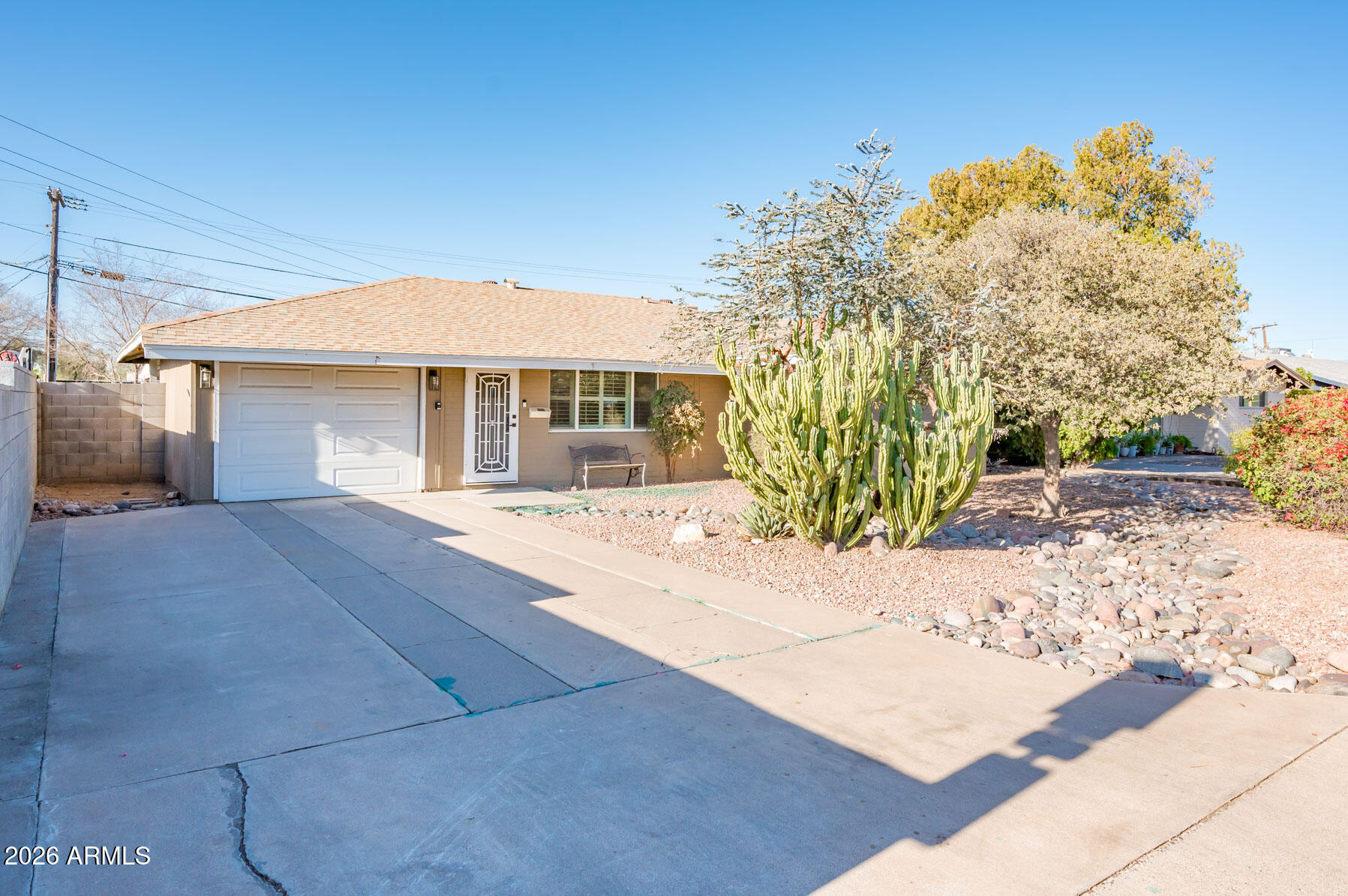 4112 6th Avenue Northwest Phoenix, AZ 85013 - Photo 1 of 23 a front view of a house with a yard