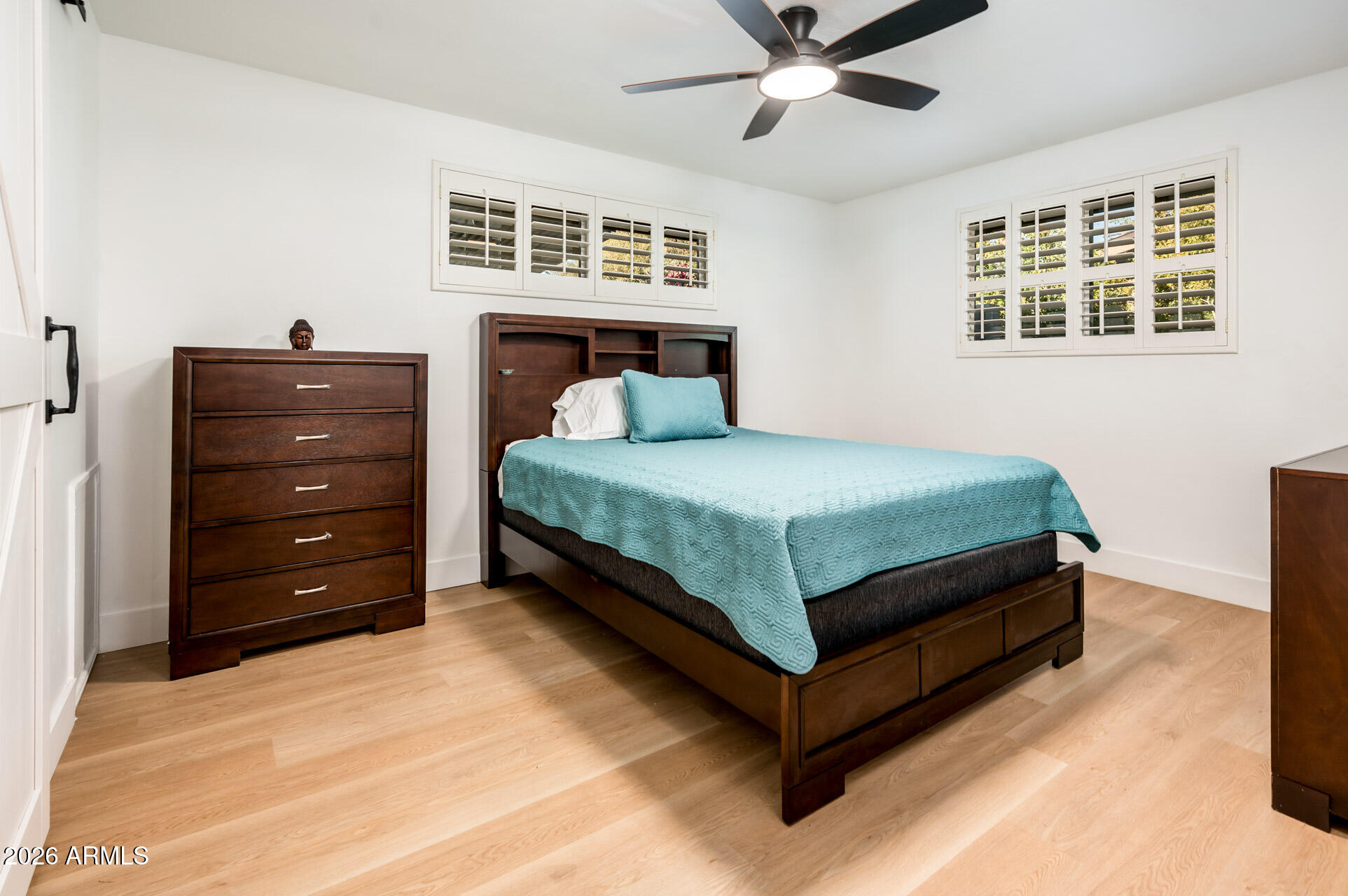 4112 6th Avenue Northwest Phoenix, AZ 85013 - Photo 14 of 23 a bedroom with a bed and ceiling fan