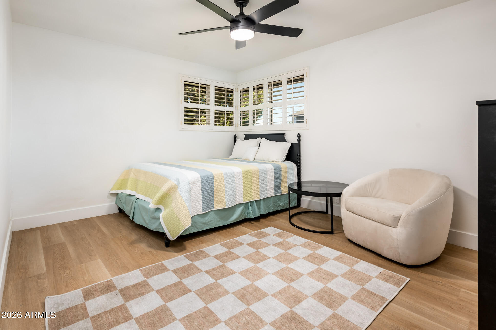 4112 6th Avenue Northwest Phoenix, AZ 85013 - Photo 17 of 23 a bedroom with a bed and a couch